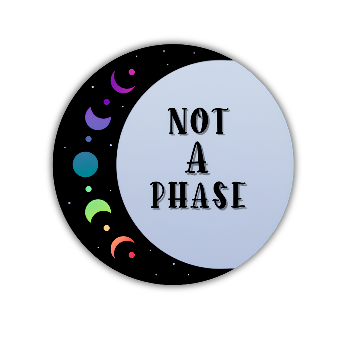 A circular sticker or button design featuring a black crescent moon with colorful planet illustrations on the left and the text 'NOT A PHASE' in black lettering on a pale blue-gray right side, shown on a white background.