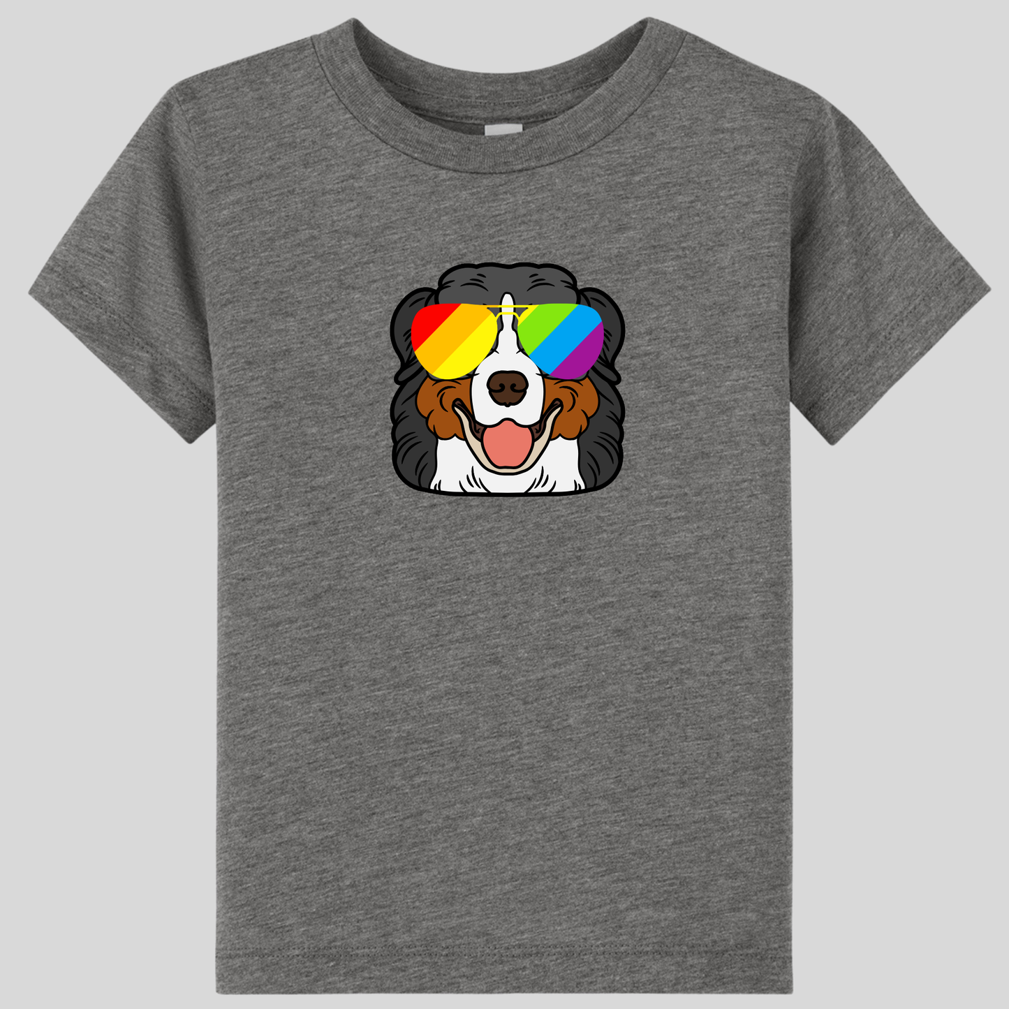 The Bernese Mountain Dog (Berner) Toddler T-shirt by RainBee Designs LLC is a gray ultra-soft triblend kids tee featuring a smiling cartoon Bernese mountain dog wearing rainbow-colored sunglasses on a plain background.