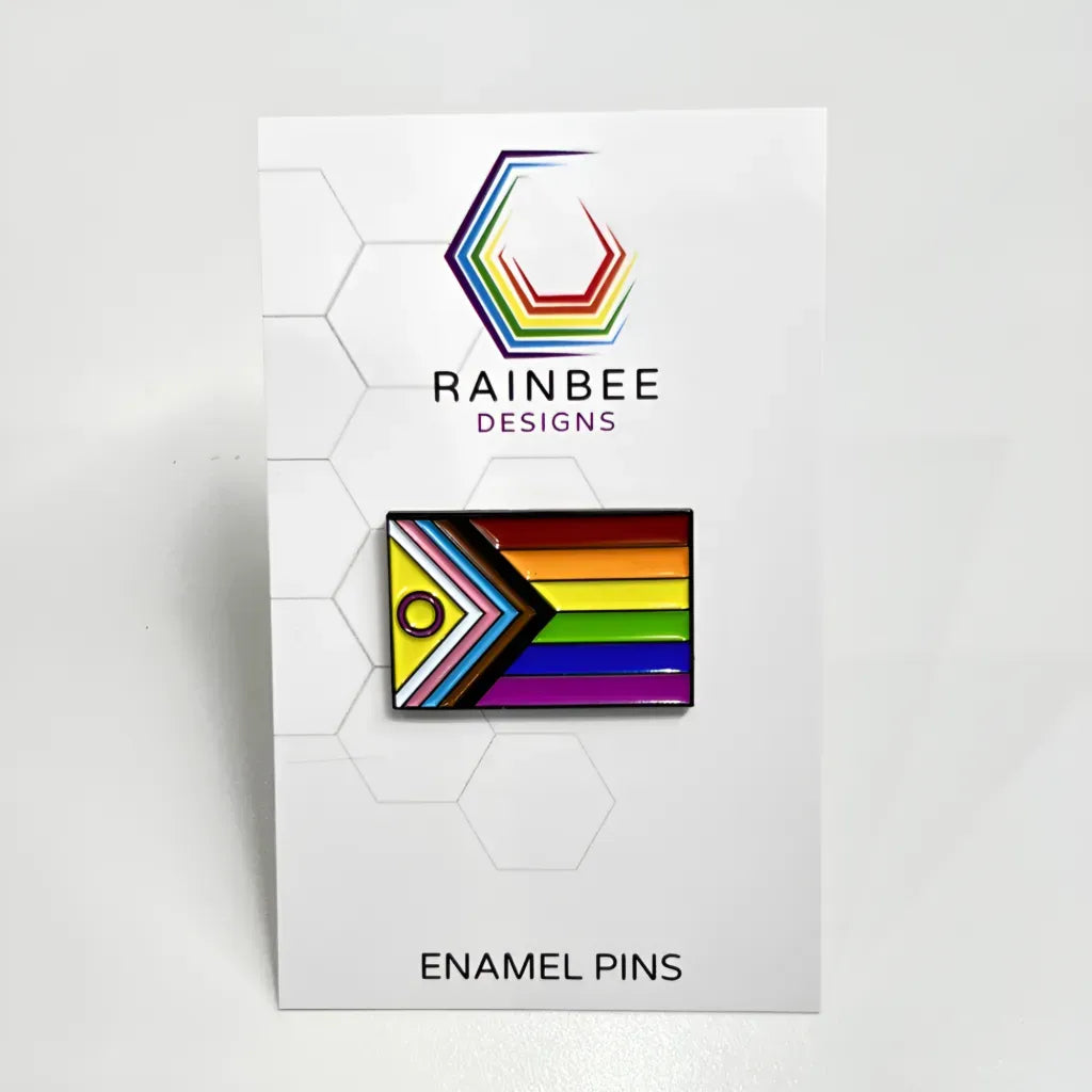 A Progress Pride Flag (with Intersex) Pin displayed on a white backer card.