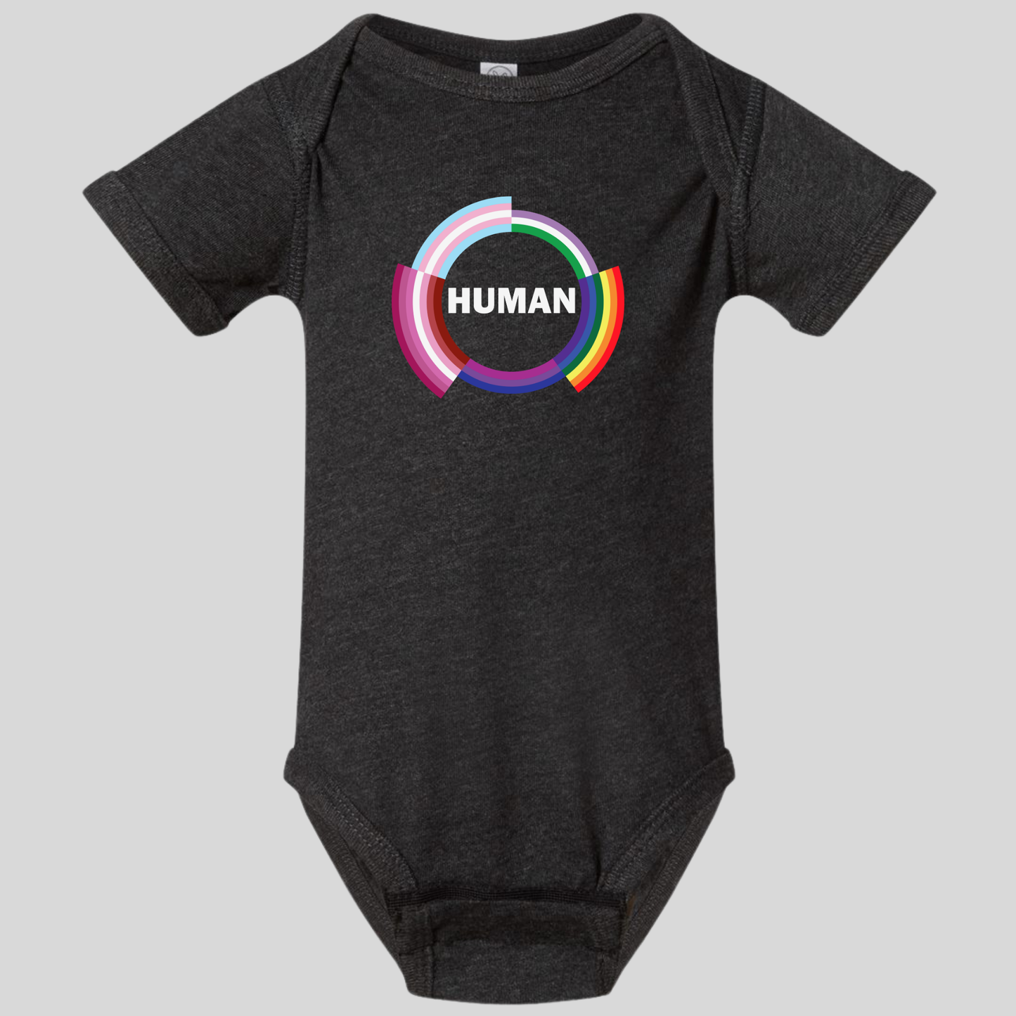 A dark gray Human Infant Onesie from RainBee Designs LLC, featuring a colorful circular design with the word HUMAN in bold white letters at the center, is displayed against a light gray background. This pride-inspired baby clothing piece combines comfort and vibrant style for your little one.