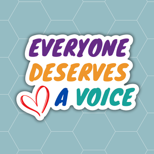 A die-cut sticker with the text 'EVERYONE DESERVES A VOICE' in purple, orange, blue, and teal lettering, accompanied by a red hand-drawn heart outline, shown on a light blue hexagonal patterned background.