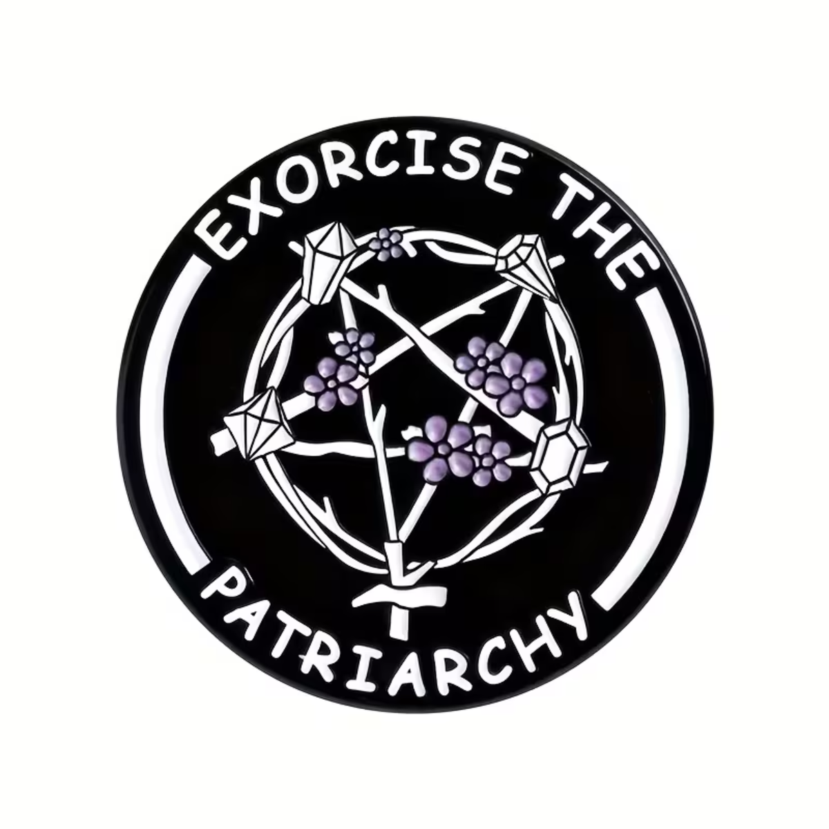 The Exorcise the Patriarchy Pin by RainBee Designs LLC is a black circular enamel pin with bold white text reading “EXORCISE THE PATRIARCHY.” At its center, it features an upside-down pentagram crafted from branches and decorated with purple flowers. This striking accessory is perfect for feminist activism.