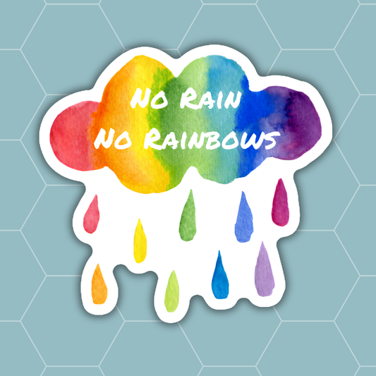 A die-cut sticker featuring a watercolor rainbow cloud with the text 'NO RAIN NO RAINBOWS' in white, with dripping raindrops below, shown on a light blue hexagonal patterned background.