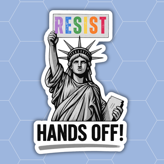 A die-cut sticker featuring a black-and-white illustrated Statue of Liberty holding a sign that says “RESIST” in rainbow colors, with the text “HANDS OFF!” below, shown on a light blue hexagonal background.