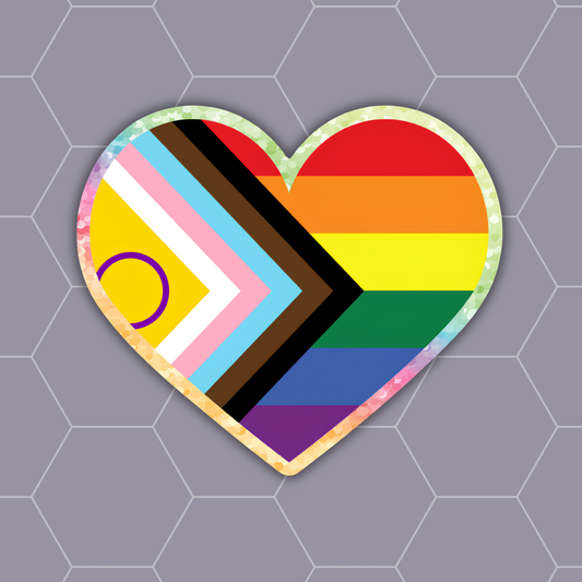 A heart-shaped sticker featuring the Progress Pride flag design with rainbow stripes and chevron bands, shown on a gray honeycomb-patterned background.