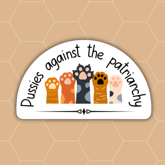 A white arched sticker with the text 'Pussies against the patriarchy' in black script, featuring five colorful illustrated cat paws standing together, shown on a tan hexagonal background.
