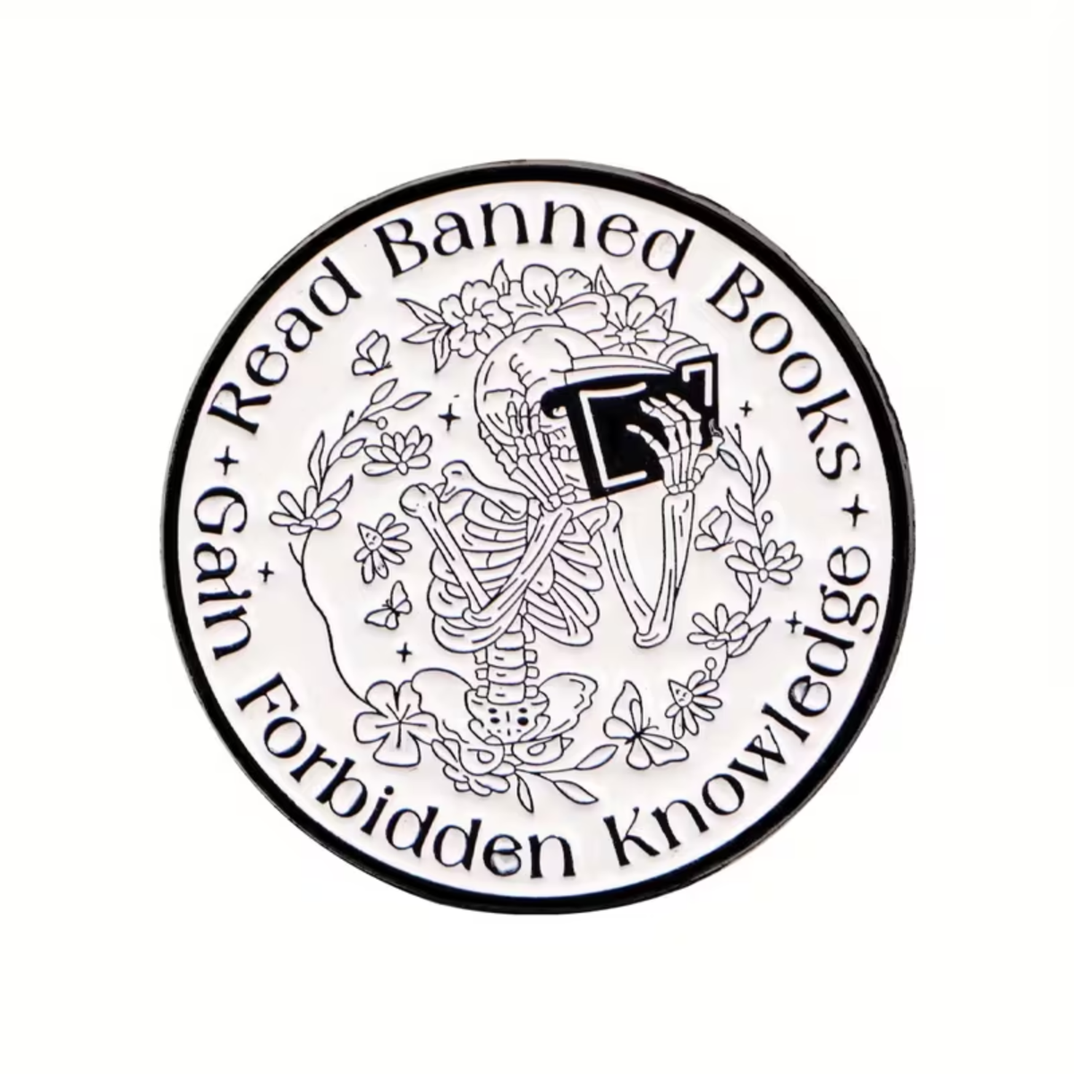 Show your love for intellectual freedom with the “Read Banned Books, Gain Forbidden Knowledge Pin” by RainBee Designs LLC. This enamel pin features a skeleton surrounded by flowers engrossed in a book, with the words “Gain Forbidden Knowledge Read Banned Books” encircling the edge—a bold celebration of stories others have tried to hide.