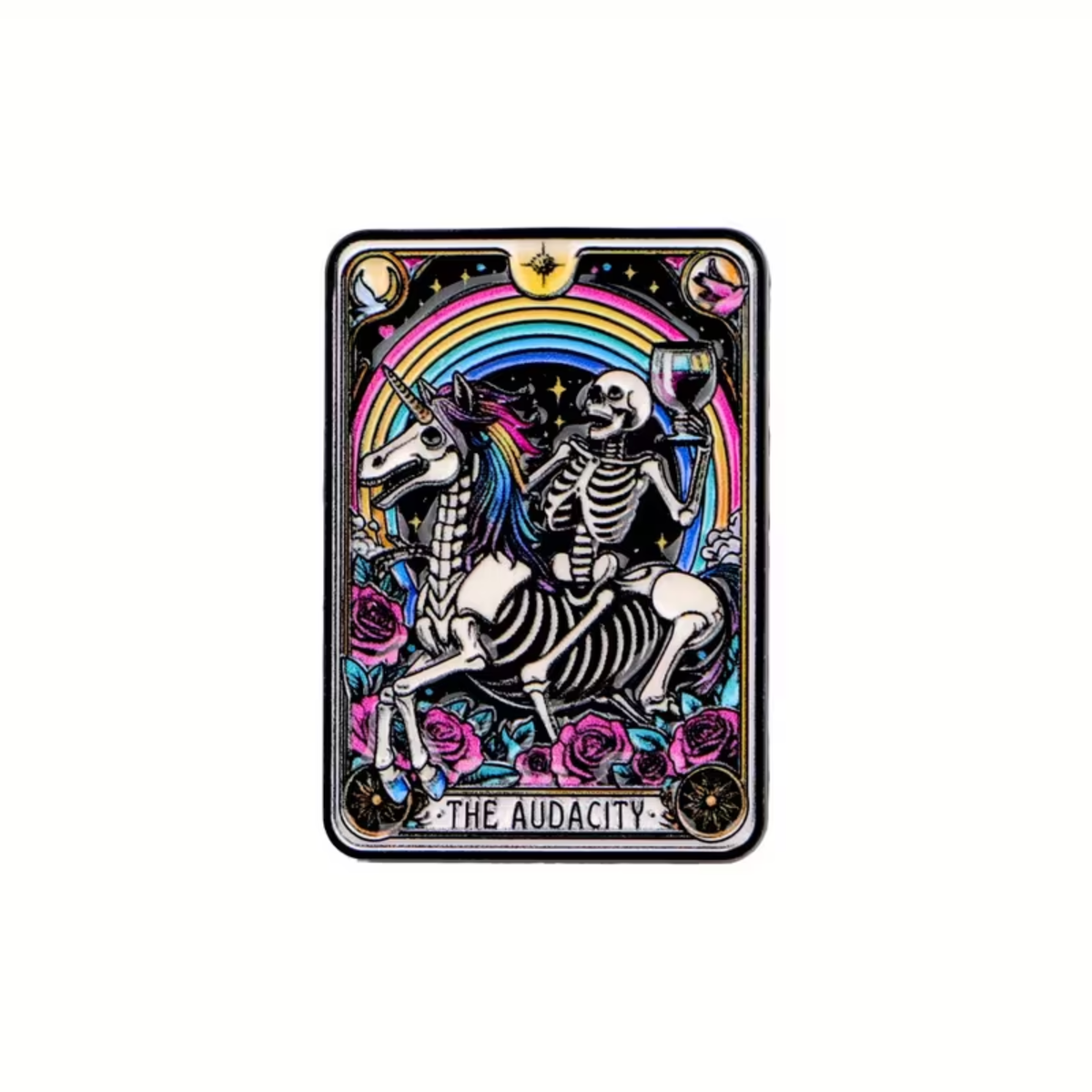 The Audacity Tarot Card Pin by RainBee Designs LLC features a skeleton riding a unicorn, cup raised beneath a rainbow and surrounded by roses. The vibrant enamel pin showcases mystical and whimsical tarot card-style art with “THE AUDACITY” text at the bottom—a true rainbow skeleton moment captured in wearable form.