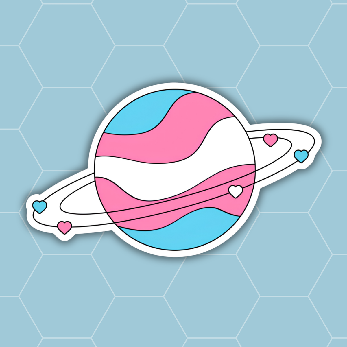 A die-cut sticker featuring a stylized Saturn with a pink, white, and light blue wavy stripe pattern, representing the transgender pride flag. The sticker is shown against a light blue background with a subtle hexagonal grid pattern.
