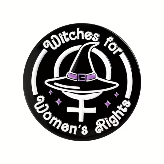 Show your support for women’s rights with the Witches For Women’s Rights Pin by RainBee Designs LLC. This round enamel accessory features the phrase “Witches for Women’s Rights” encircling a witch hat atop a women’s symbol, beautifully accented with purple stars. It’s the perfect feminist pin to proudly display your beliefs.